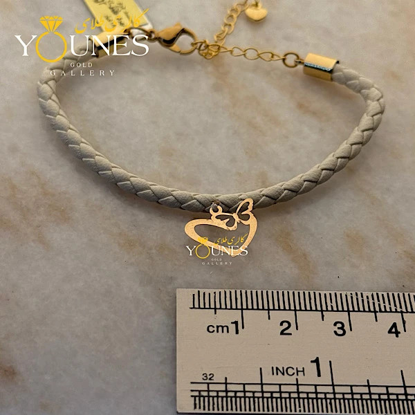 دستبند چرم طوسی شاپرک قلبی طلا